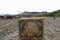 Close up of dirty stone contains logo of Bromo Tengger Semeru National Park