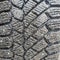 Close up of dirty winter rubber car wheel tread