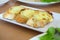 Close-up of a dish of garlic bread with cheese