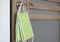 Close-up of disposable surgical face  masks hanging from the door latch .Precaution measures against COVID-19 at entrance in