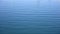 Close up of disturbed blue ocean water surface. Slow motion