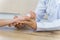 Close up of a doctor holding the patient hands doing basic medical examination and diagnostic