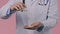 Close up doctor in medical uniform pouring all pills down, holding them in palm