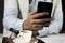 Close-up of doctor using phone at his office, doctor working online, Online consultation. Unrecognizable doctor uses smartphone at