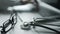 Close up of a doctor is working and typing on laptop in a clinic. Physician is filling in patient electronic record and