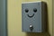 close-up of doorbell button, with the sound of a cheerful chime in the background