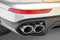 Close up of double chrome exhaust pipe of a white powerful modern sport car.