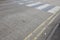 Close-Up of double yellow line on road and Zebra crossing