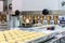 Close up dough or cream and nozzle discharge of automatic biscuit or sweets making machine in production line for high technology