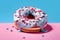 Close up of a doughnut sprinkled with frosting and red blue candy bits. Generative AI