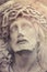 Close up dramatic statue of crucified Jesus Christ (styled vintage)