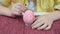 Close-up, drawing an Easter pattern on a pink egg