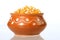 Close-up of Dried corn in a clay pot on white background