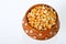 Close-up of Dried corn in a clay pot on white background