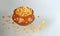 Close-up of Dried corn in a clay pot on white background