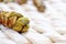 Close-up of dried Dendrobe flowers arranged in a rustic wicker basket