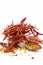Close up of dried red chili with its flakes or Crushed red pepper isolated on white.