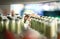 Close up of drink shelf in supermarket. Alcohol, soda, sodapop, mineral water or ginger ale bottle. Customer buying product.