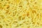 Close up of dry Chinese yellow egg noodles background and texture