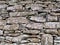 A close up of the dry stone wall structure of the Broch of Clickimin in Lerwick, Shetland, UK