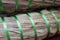 A close up of a dry straw wrapped in a green rope
