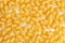 Close-up of dry uncooked cellentani pasta background