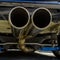 Close up of dual exhaust pipe at the back of car