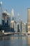 Close up of Dubai Marina during the day in the Jumeriah area looking at the skyscrapers, skyline and creek portrait view
