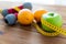 Close up of dumbbell, fruits and measuring tape
