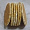 Close-up of dutch stroopwafels on a sheet of kraft paper. sweet caramel waffle selective focus photo