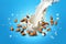 Close up of dynamic splashes of almond milk and flying nuts on a bright blue background