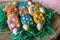 Close up of Easter cookies in shape of eggs on grass at home