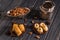 Close up. Eastern still life. Turkish traditional homemade baklava. Pottery and silver candlestick. Dark wooden background