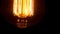 Close up Edison bulb in the dark room.
