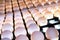 Close-up of eggs on a conveyor belt in a special back-lit bunker to check for micro cracks in the shell. Poultry farm. Industrial