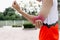 Close Up on elbow Injury. The man use hands hold on his elbow while running in the park. space for text or design. highlight on