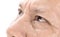 Close-up of elderly asian man eyes with wrinkle on face