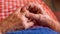 Close up elderly hands of a widowed old woman holding rings. Caucasian grandma