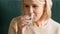 Close up of elderly woman drinking still water