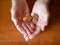 Close Up of Elderly Woman`s Hands Holding Pennies