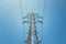 Close up of electrical tower and blue sky. Renewable energy and smart grid