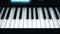 Close-up of electronic piano keys. Smart feed on abstract keys of glowing electronic piano. Musical instruments