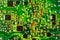 Close-up of an electronic printed green computer circuit board.