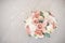 Close-up elegant bouquet of flowers with roses diathus carnation bohemia chrysantemum on light background indoors