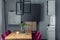 Close up on elegant details of dining room interior design. Velvet chairs, wooden table and beautiful accessories. Open space.