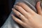 Close up of an elegant diamond ring on young woman finger