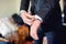 Close up of elegant man, groom hands with suits, ring, necktie