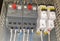 Close-up elements of electrical switchgear. Automatic electrical switches in working position. Selective focus