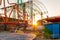 Close-up of empty carousel roundabout chain ride at sunset