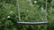 Close-up of An Empty Iron Swing With Trees In The Background, Selected Focus